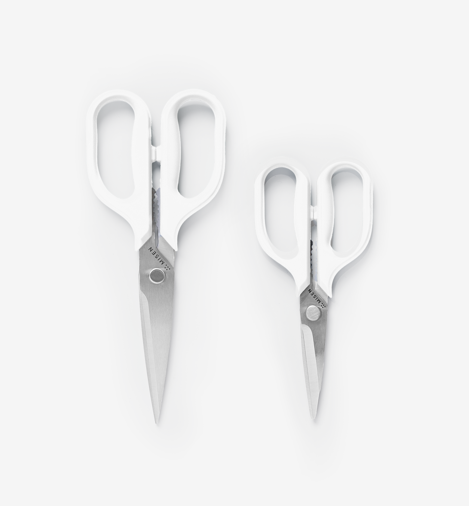 Misen kitchen shears in two sizes with white handles and stainless steel blades